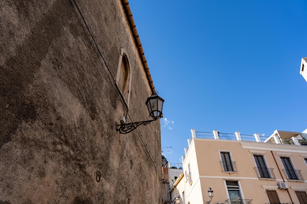 A lamp is hanging from a building