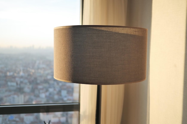 A lamp in a room against window