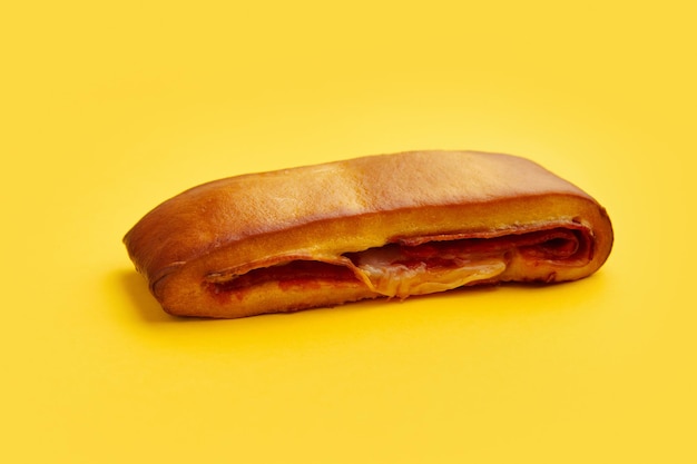 Lanche misto traditional portuguese sandwich with cheese and chorizo tasty breakfast over yellow bac