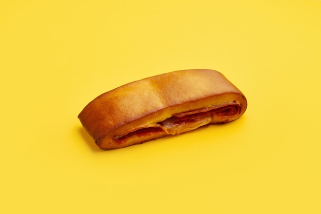 Lanche misto traditional portuguese sandwich with cheese and chorizo Tasty breakfast over yellow background Restaurant cafe menu