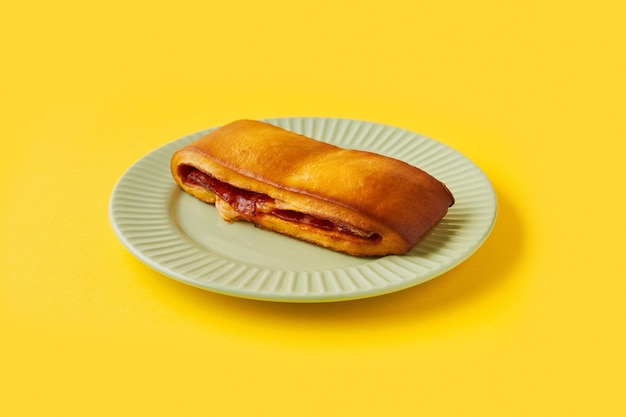 Lanche misto traditional portuguese sandwich with cheese and chorizo Tasty breakfast over yellow background Restaurant cafe menu