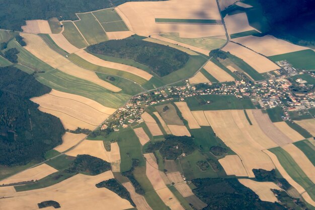 The land with meadows forests settlement view from above