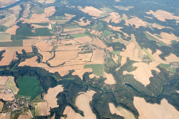 The land with meadows forests settlement view from above