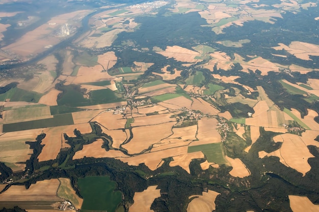 The land with meadows forests settlement view from above