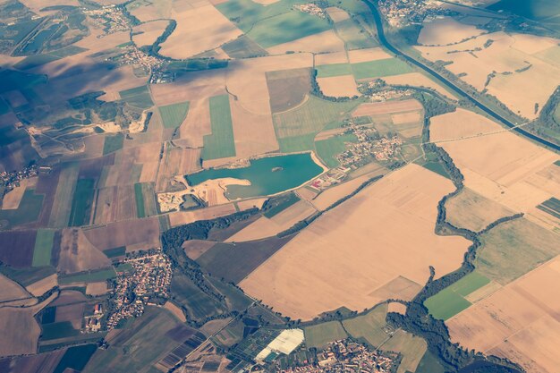 The land with meadows forests settlement view from above