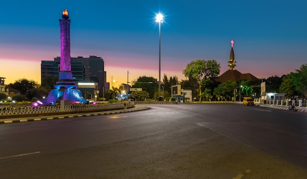 Landmark of tugumuda on a beautiful morning against the background of the cathedral church semarang