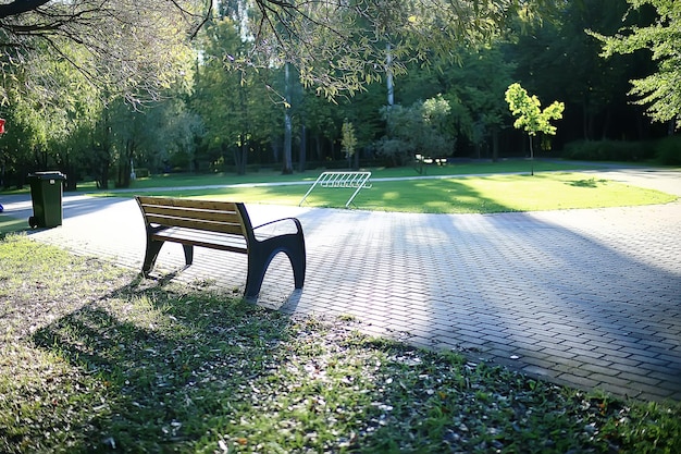 landscape in autumn park bench / beautiful garden bench, concept of rest, nobody in autumn park, landscape background, fall