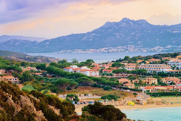 Landscape of Baja Sardinia luxury resort in Costa Smeralda at sunset in the evening, Sardegna island in Italy in summer. Scenery in Olbia province. In the Mediteranean sea