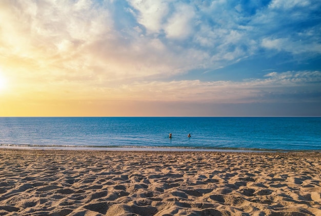 Landscape of beach at sunset with dramatic cloudy sky