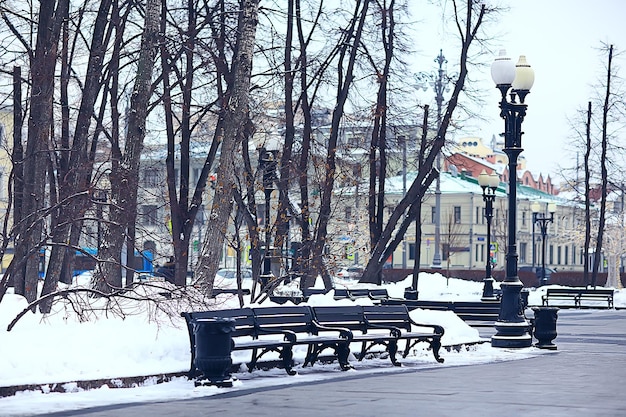 landscape bench in city park winter frost, christmas morning in the city