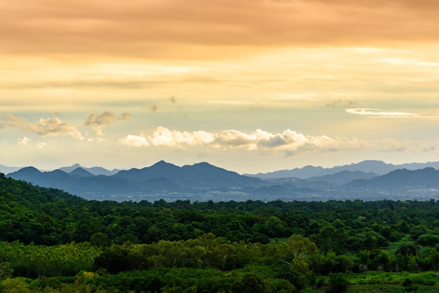 Landscape of cloudy, mountain and forest with sunset in the evening from top view.