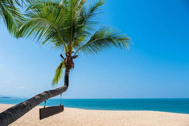 Landscape of coconut palm tree, Beautiful blue sea tropical beach. Summer background concept.  