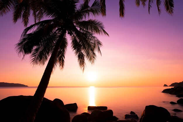 Landscape Long exposure of majestic clouds in the sky sunset or sunrise over sea with reflection in the tropical sea Beautiful seascape scenery Amazing light of nature sunset