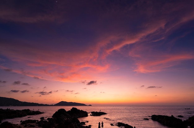 Landscape Long exposure of majestic clouds in the sky sunset or sunrise over sea with reflection in the tropical seaBeautiful cloudscape sceneryAmazing light of nature Landscape nature background