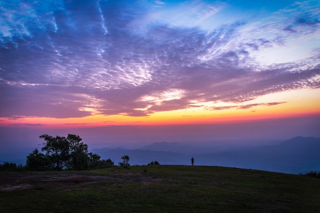 Landscape Man on hill sky sunset clouds colorful sky blue purple