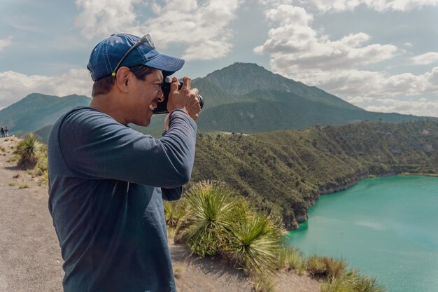 Landscape man photographer taking photos in an amazing wilderness environment lagoons