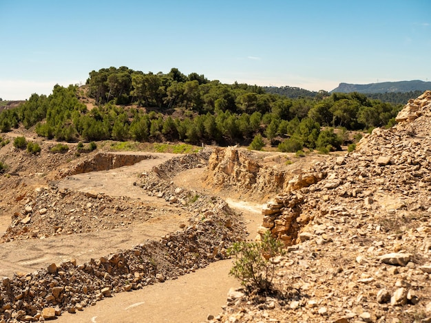 Landscape of an old quarry with mountains on a background