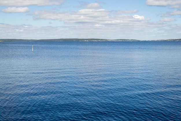 Landscape overlooking the lake on a clear sunny day Lake Onega with the embankment of the city