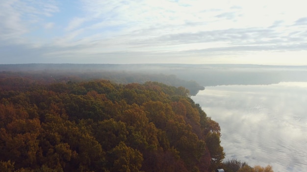 Landscape river near the hills. autumn, morning, fog. Aerial view.