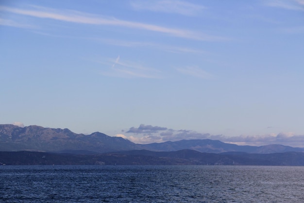 Landscape of sea and mountains. Everything is blue.