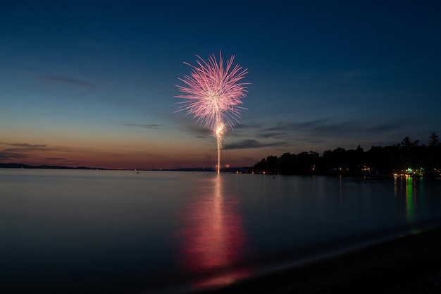 Landscape of the sea with fireworks above it in the evening - perfect for wallpapers