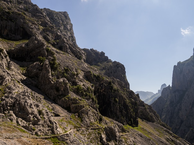 Landscape of trail crossing the mountains on the edge of the precipice