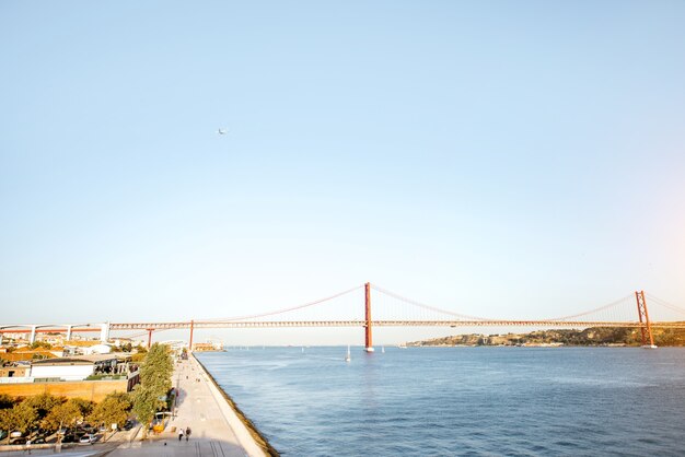 Landscape view on the 25th of April Bridge during the sunset in Lisbon city, Portugal