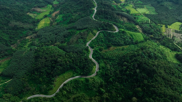 Landscape view of long curve road No1081 also known as over sky road is a long road behind the mountain beautiful in the last rainy season and early winter of nan province thailand