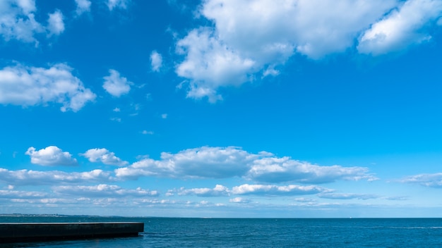 Landscape white clouds on a blue sky over the sea