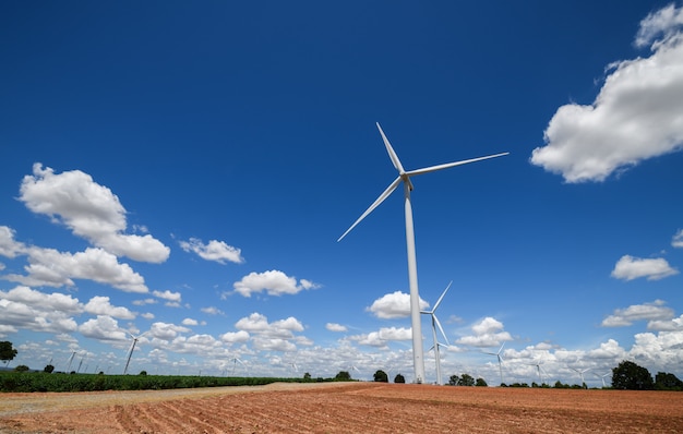 Landscape of Windmills for electric power production with white cloud and blue sky