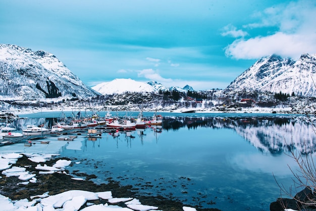 Landscape with beautiful winter lake and snowy mountains at Lofoten Islands in Northern Norway.