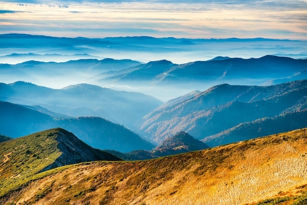 Landscape with blue mountains and yellow hills