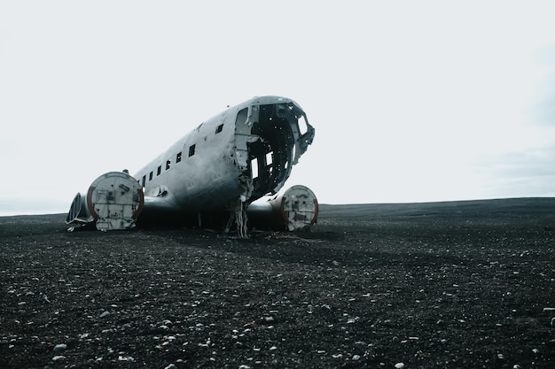 Landscape with copy space of crashed airplane in Iceland on the beach of Solheimasandur Moody ambient social network image Travel to Iceland road trip concept Copy space image visit Iceland