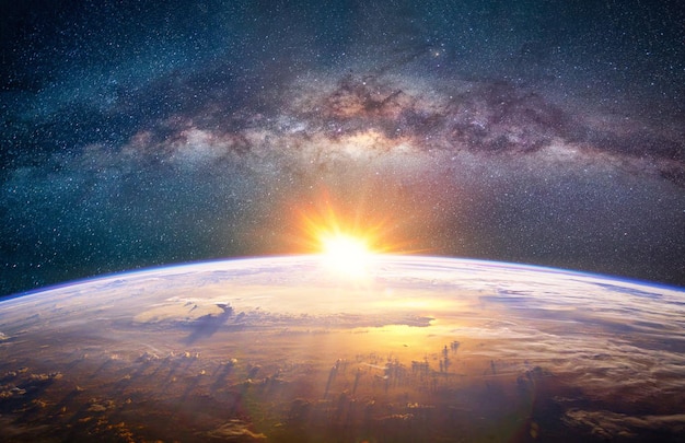 Landscape with Milky way galaxy Sunrise and Earth view from space with Milky way galaxy Elements of this image furnished by NASA