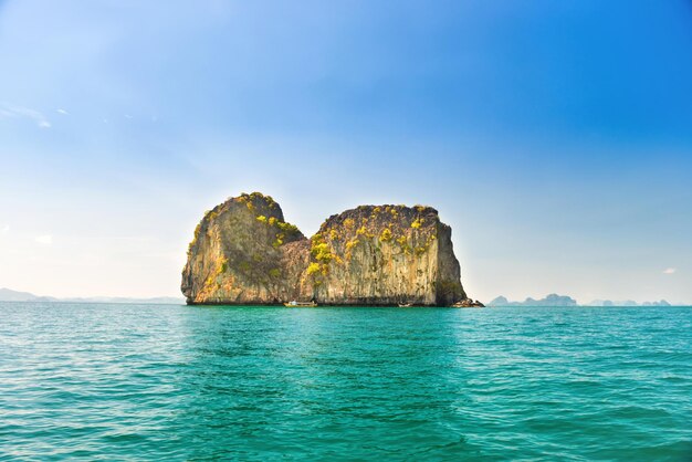 Landscape with rocky islands in tropical sea and blue sky