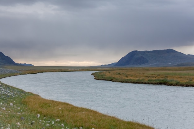 Landscapes of Mongolia, River, mountains and beautiful summer sky.