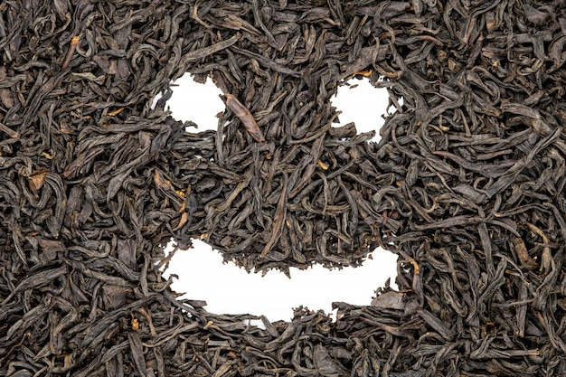 Lapsang souchong tea, funny smile face shaped, close up. 