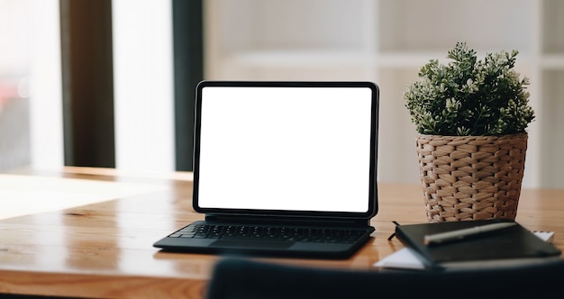 Laptop blank screen on wood table with coffee cafe background, mockup, template for your text, Clipping paths included for background and device screen