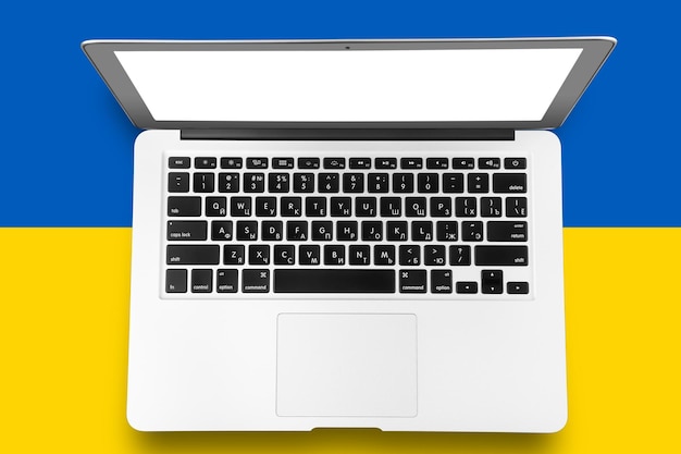 Laptop on a blue and yellow background flag of ukraine