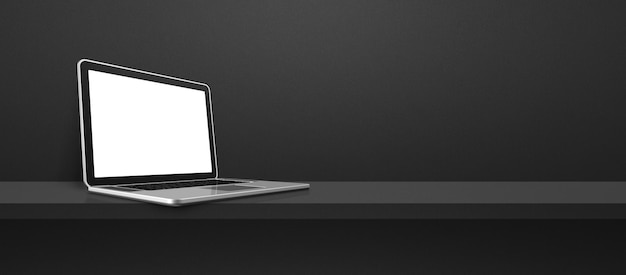 Laptop computer on black shelf background banner