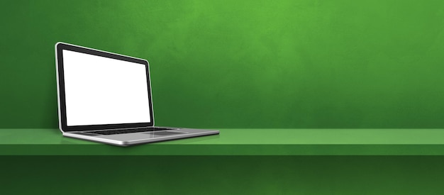 Laptop computer on green shelf background banner