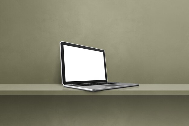 Laptop computer on green shelf background