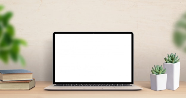 Laptop computer mockup on work desk. Close-up scene with plants and books on table. Modern, thin laptop design. Isolated screen for mockup, app or web site promotion