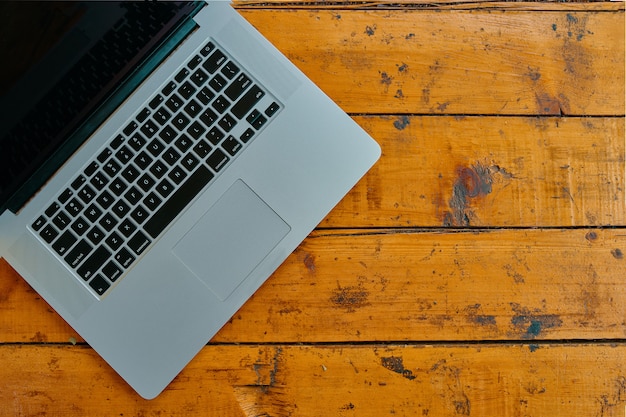 Laptop computer on office table background. 