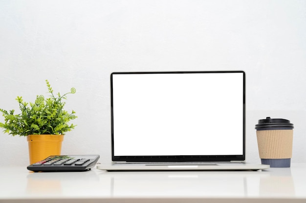 Laptop computer with blank screen in office