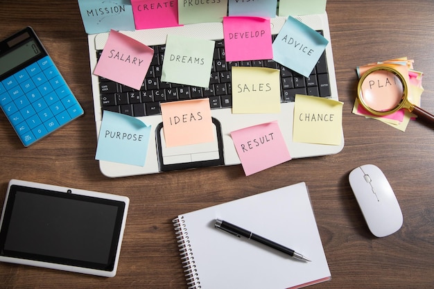 Laptop computer with colorful sticky notes Business