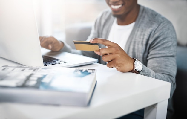 Laptop credit card and man for home online shopping e learning and fintech payment loan or happy finance Student or person hands and on floor typing banking information and computer transaction