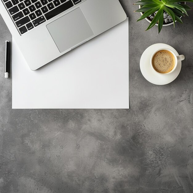 Photo a laptop and a cup of coffee on a table with a cup of coffee