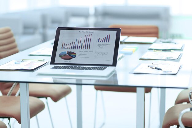 Laptop and financial reports on the Desk of a businessman