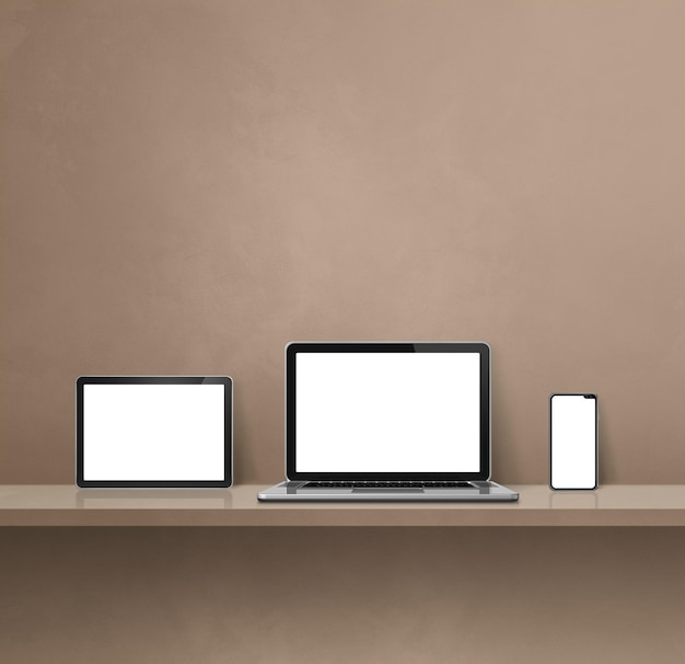 Laptop mobile phone and digital tablet pc on brown wall shelf Square background